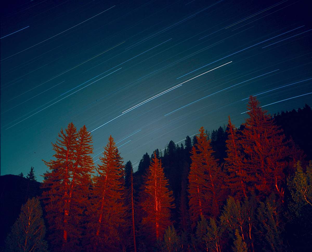 night sky time lapse photo of star trail during nighttime stars